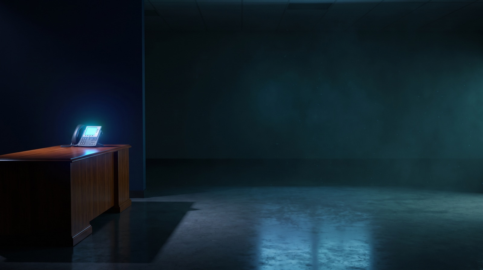A desk phone glowing alone in a dark, empty office at night with no one there to answer it.